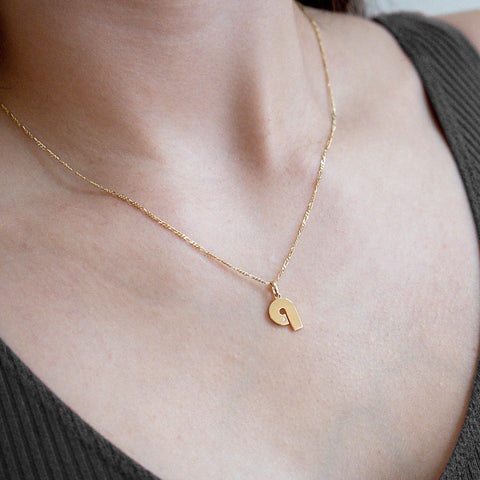 Model Wearing 14K Gold “Q” Initial Pendant Necklace