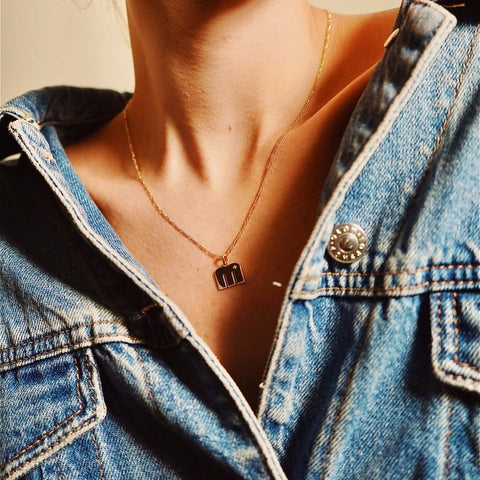 Model wearing our 14K Gold “M” Initial Pendant Necklace